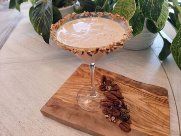pecan pie flavored martini with pecan and carmel coated rim