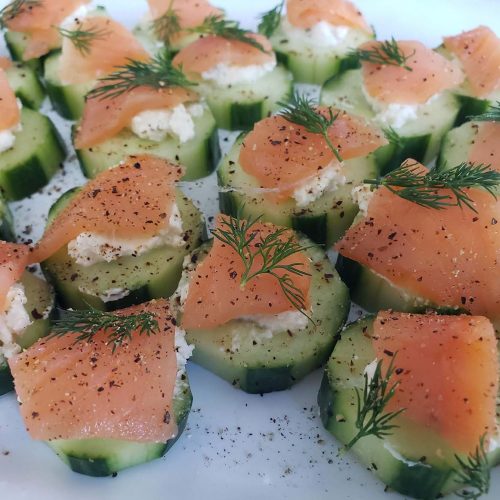 Sliced cucumbers with lox and soft cheese