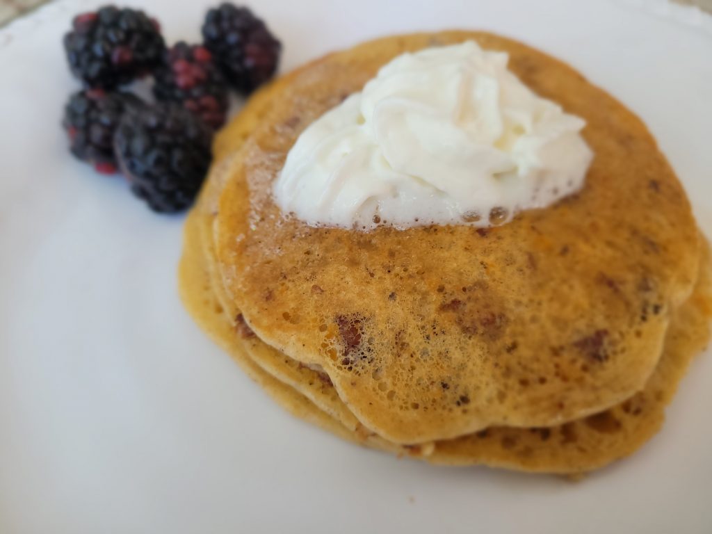 Sweet Potato pancakes with butter and berries