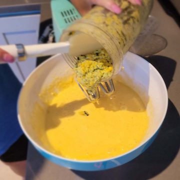 combining corn cilatro and cake batter