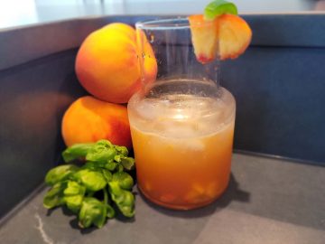 Peach moonshine with cardamom bitters