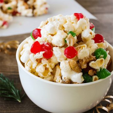 Bowl of holiday popcorn with red and green dried fruit