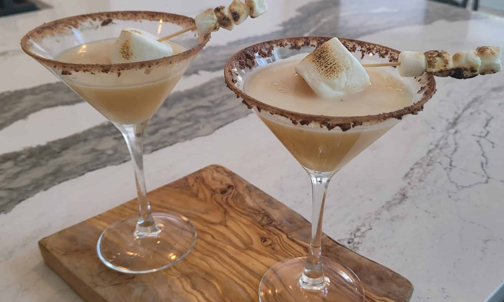 skewball whisky drink in a martini glass and a chocolate rim, topped with a marshmellow