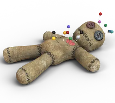 voodoo doll with pins in it