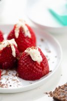 cored strawberries with booze infused creme piped in