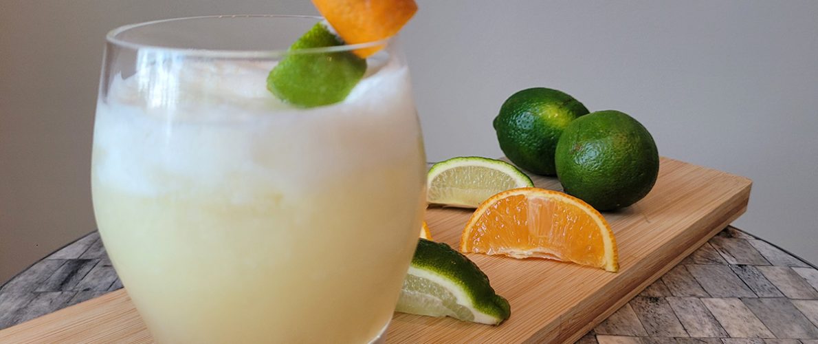 Tropical Rum cocktail with orange and limes